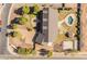 Aerial view of backyard with pool, gazebo, fireplace, basketball court, and large lush manicured lawn at 1409 E Dove Pl, Casa Grande, AZ 85122