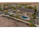 Beautiful backyard oasis with a pool, gazebo, and a basketball court, fully fenced for privacy and secure outdoor living at 1409 E Dove Pl, Casa Grande, AZ 85122