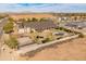 Aerial view of backyard, showcases a pool, cabana, basketball court, and large covered patio at 1409 E Dove Pl, Casa Grande, AZ 85122