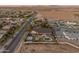 Aerial view of home with pool, tennis court, outdoor kitchen, gazebo, mountain views and well-manicured lawn at 1409 E Dove Pl, Casa Grande, AZ 85122