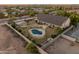 Gorgeous landscaped backyard features a sparkling pool, cozy gazebo, and a basketball court, creating a serene outdoor retreat at 1409 E Dove Pl, Casa Grande, AZ 85122