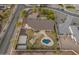 Private backyard featuring a sparkling pool, inviting gazebo, and a full basketball court, offering a perfect blend of relaxation and activity at 1409 E Dove Pl, Casa Grande, AZ 85122