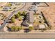 Aerial view of a backyard featuring a pool, cabana, and sports court at 1409 E Dove Pl, Casa Grande, AZ 85122