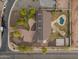 Well-manicured property with mature trees and an inviting entrance, set against a backdrop of a serene neighborhood at 1409 E Dove Pl, Casa Grande, AZ 85122