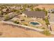 A backyard oasis with a pool, cabana, and basketball court; perfect for outdoor living and entertainment at 1409 E Dove Pl, Casa Grande, AZ 85122