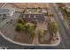 An aerial view of a home featuring a large backyard with a pool, a basketball court, and desert landscaping at 1409 E Dove Pl, Casa Grande, AZ 85122