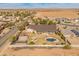 Backyard features a basketball court, pool, cabana, and covered patio at 1409 E Dove Pl, Casa Grande, AZ 85122