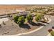 Charming home with mature trees, desert landscaping, and three dormer windows provides great curb appeal at 1409 E Dove Pl, Casa Grande, AZ 85122