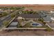 Aerial shot of house with pool, gazebo, outdoor kitchen, tennis court, basketball court, and covered patio at 1409 E Dove Pl, Casa Grande, AZ 85122