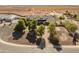 A beautiful home with desert landscaping featuring mature trees and a brick driveway at 1409 E Dove Pl, Casa Grande, AZ 85122
