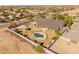 A backyard oasis featuring a pool, cabana, and basketball court for endless fun and relaxation at 1409 E Dove Pl, Casa Grande, AZ 85122