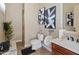 Well-lit bathroom features modern fixtures, stylish art, and a convenient walk-in shower at 1409 E Dove Pl, Casa Grande, AZ 85122