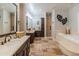 A spacious bathroom featuring dual vanities, a soaking tub, and a separate shower at 1409 E Dove Pl, Casa Grande, AZ 85122
