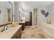 Large bathroom with double vanities, a soaking tub, and a separate shower at 1409 E Dove Pl, Casa Grande, AZ 85122