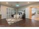 Elegant bedroom featuring hardwood floors, canopy bed, and lots of natural light at 1409 E Dove Pl, Casa Grande, AZ 85122