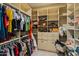 Large walk-in closet with custom shelving, drawers, and ample hanging space at 1409 E Dove Pl, Casa Grande, AZ 85122