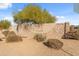 Stone community entrance sign surrounded by desert landscaping at 1409 E Dove Pl, Casa Grande, AZ 85122