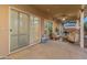 Extended covered patio, complete with cozy seating areas and views of the private landscaped backyard at 1409 E Dove Pl, Casa Grande, AZ 85122