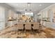 Elegant dining room with seating for eight, a decorative chandelier, and travertine flooring, perfect for hosting dinner parties at 1409 E Dove Pl, Casa Grande, AZ 85122