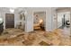 Spacious foyer with travertine flooring, decorative wall art, and views into other areas of the home at 1409 E Dove Pl, Casa Grande, AZ 85122