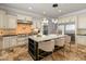 Kitchen island with granite countertops, stainless appliances, pendant lighting, and seating for three at 1409 E Dove Pl, Casa Grande, AZ 85122