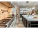 The kitchen showcases a professional range, sleek countertops, stainless steel appliances, and a convenient pot filler faucet at 1409 E Dove Pl, Casa Grande, AZ 85122