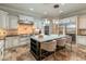 Gourmet kitchen with stainless appliances, custom cabinets, breakfast bar, and designer touches for culinary enthusiasts at 1409 E Dove Pl, Casa Grande, AZ 85122