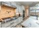 This gourmet kitchen is equipped with stainless steel appliances, custom cabinetry, granite countertops, and designer tile backsplash at 1409 E Dove Pl, Casa Grande, AZ 85122