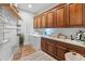 Functional laundry room features ample storage, modern appliances, and a convenient sink for everyday tasks at 1409 E Dove Pl, Casa Grande, AZ 85122