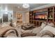 Inviting living room boasts a custom entertainment center and comfortable seating for relaxed gatherings and entertainment at 1409 E Dove Pl, Casa Grande, AZ 85122