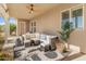 Relaxing covered patio with a comfortable seating area and stylish decor, perfect for outdoor living at 1409 E Dove Pl, Casa Grande, AZ 85122