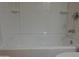 Clean white bathtub with chrome fixtures and tile surround at 151 E Broadway Rd # 210, Tempe, AZ 85282