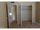 Bedroom closet with door open and neutral carpet at 151 E Broadway Rd # 210, Tempe, AZ 85282