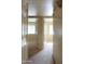 Hallway leading to bedrooms with neutral carpet and paint at 151 E Broadway Rd # 210, Tempe, AZ 85282