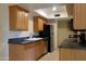 Galley-style kitchen boasts modern appliances and ample cabinet space for storage at 151 E Broadway Rd # 210, Tempe, AZ 85282