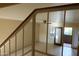 Living room featuring tile floor, ceiling fan, access to a patio, and a staircase at 151 E Broadway Rd # 210, Tempe, AZ 85282