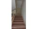 Carpeted staircase with white railing at 151 E Broadway Rd # 210, Tempe, AZ 85282