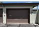 Attached garage with a brown door at 17205 N 107Th Ave, Sun City, AZ 85373