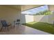 Outdoor patio with artificial grass, a table, and seating, perfect for relaxation and entertainment at 17205 N 107Th Ave, Sun City, AZ 85373