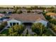 Bird's eye view of a single-Gathering home with a paver patio, desert landscaping, and tile roofing at 1725 E Everglade Ln, Gilbert, AZ 85298
