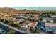 Stunning aerial view of a bright home with a private pool and beautiful mountain views in a well-manicured community at 1725 E Everglade Ln, Gilbert, AZ 85298
