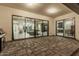Expansive outdoor living area with seamless transition to multiple rooms through large glass doors at 1725 E Everglade Ln, Gilbert, AZ 85298