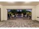 Backyard featuring a water feature, rock landscaping, pavers, and mature palm and deciduous trees at 1725 E Everglade Ln, Gilbert, AZ 85298