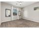 This spacious bedroom is well-lit with neutral tones and plush carpeted floors at 1725 E Everglade Ln, Gilbert, AZ 85298