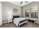 This well-lit bedroom features carpeted floors and a large window for plenty of natural light at 1725 E Everglade Ln, Gilbert, AZ 85298