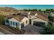 Attractive single-Gathering home with desert landscaping, tile roof, and a three-car garage at 1725 E Everglade Ln, Gilbert, AZ 85298