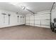 This garage features a sealed floor, an automatic door, and lots of wall space for tools and equipment at 1725 E Everglade Ln, Gilbert, AZ 85298