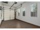 This garage features clean white walls, natural light from multiple windows, and an epoxy floor at 1725 E Everglade Ln, Gilbert, AZ 85298