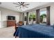 This light filled main bedroom features large windows with backyard views and neutral tones at 1725 E Everglade Ln, Gilbert, AZ 85298