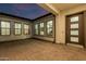 Covered patio with views into the house through a series of well placed windows and a door for easy access at 1725 E Everglade Ln, Gilbert, AZ 85298